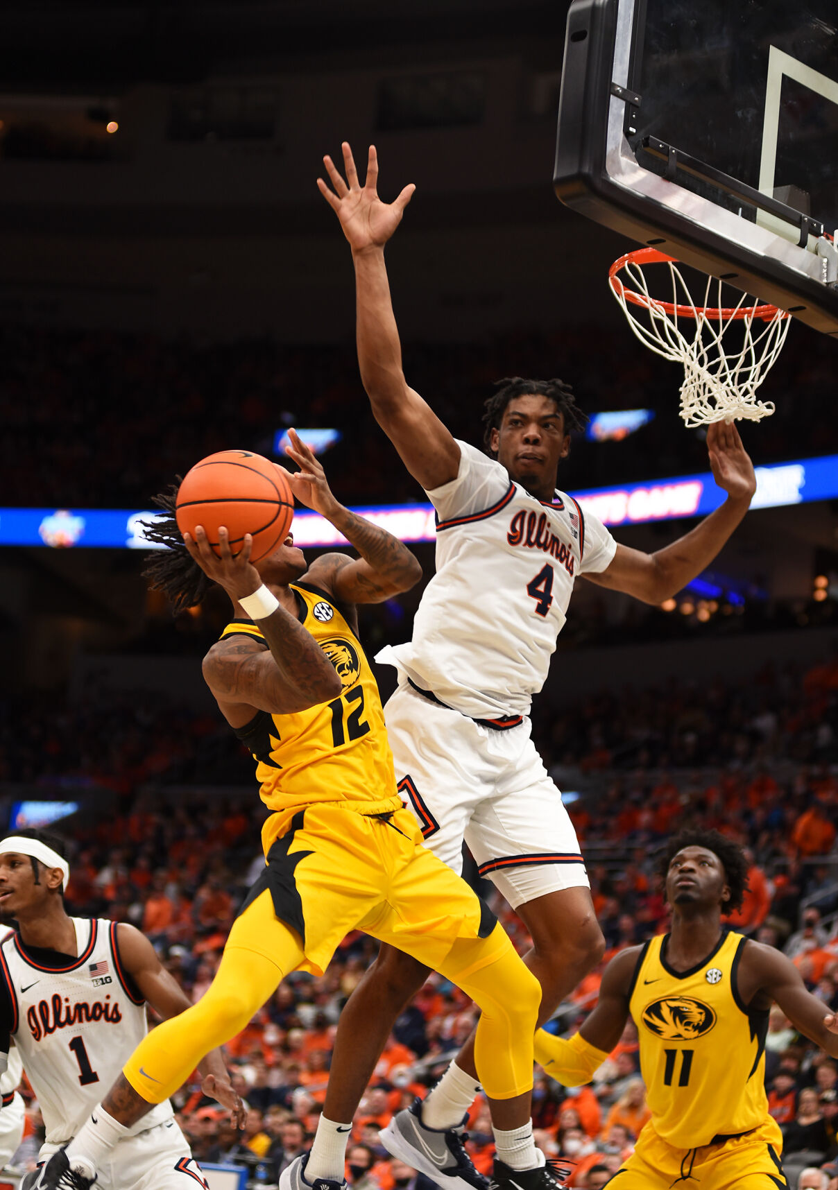 DaJaun Gordon jumps for a basket as Illinois' Omar Payne attempts to block him